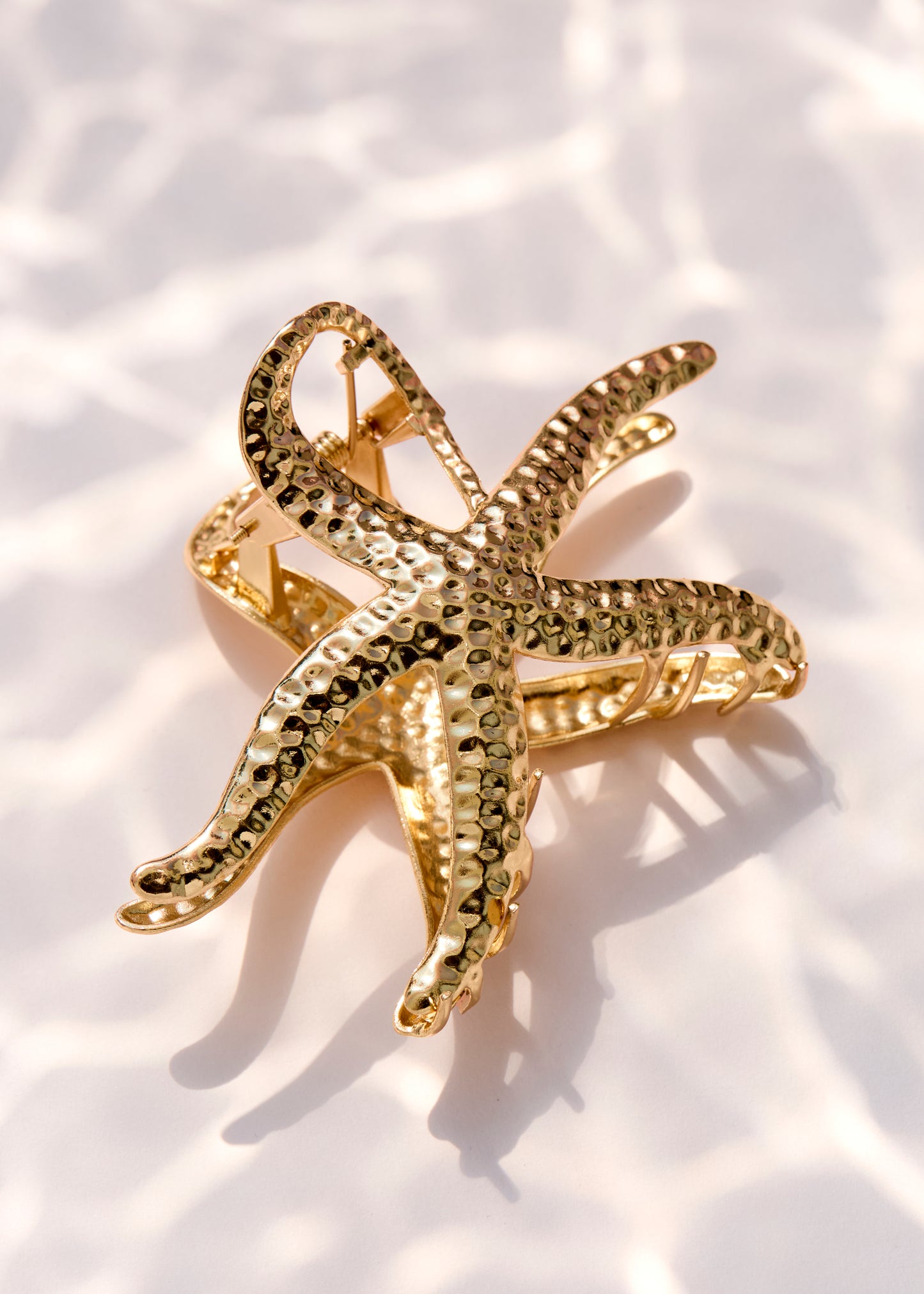 Pince à cheveux étoile de mer dorée